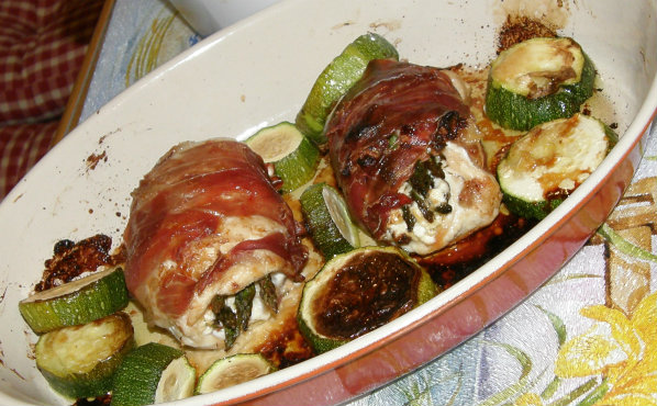 Chicken stuffed with asparagus and cream cheese wrapped in parma ham