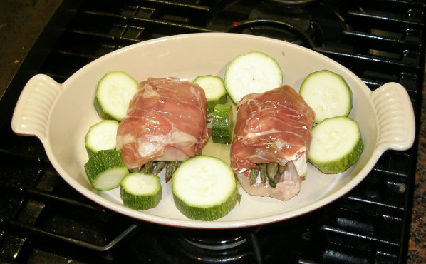 Chicken stuffed with Asparagus and Cream cheese wrapped in parma ham ready to cook