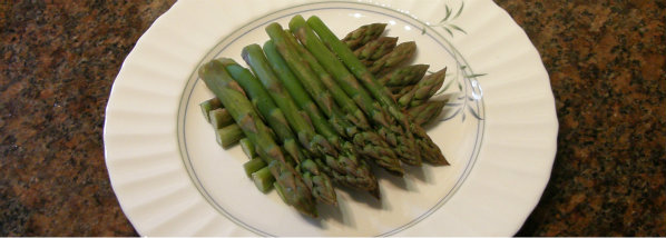 Bed of asparagus ready for topping with poached egg