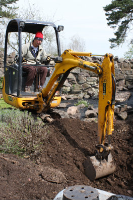Digging an asparagus bed in style with a mini digger!