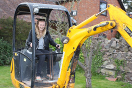 Emma drives the digger