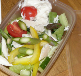 Lunch box contains chopped veg including Asparagus